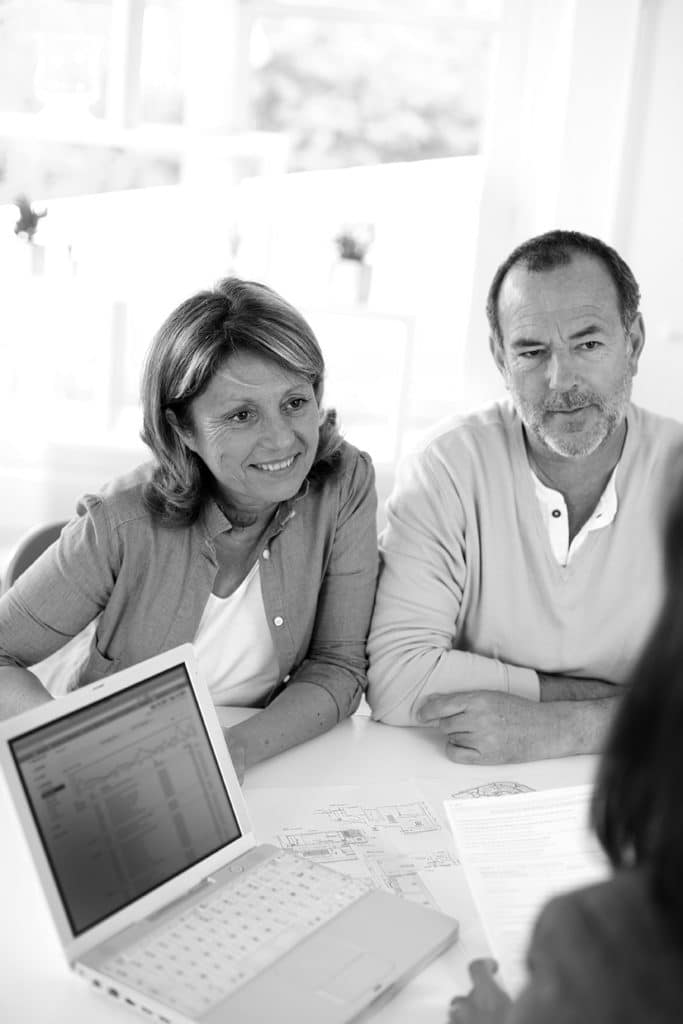 senior couple listening to advisor