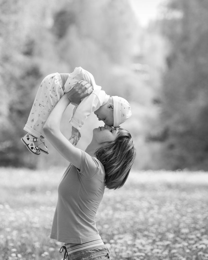 mom and baby in a park setting