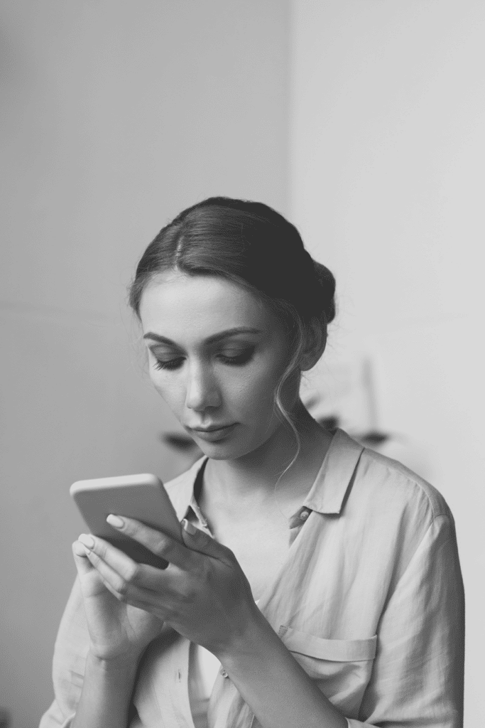 woman looking at her smart phone